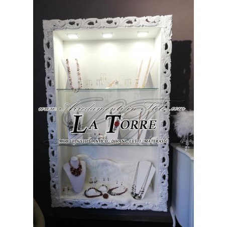 Suspended wall-mounted Baroque style showcase with perforated frame, custom-made bottle holder and TV box