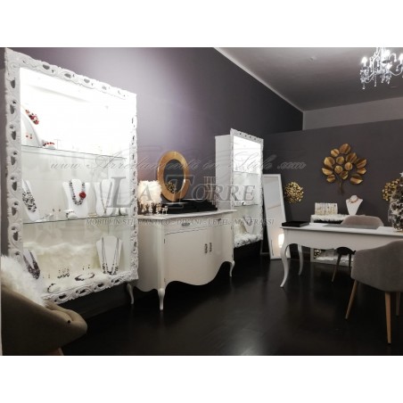 Suspended wall-mounted Baroque style showcase with perforated frame, custom-made bottle holder and TV box